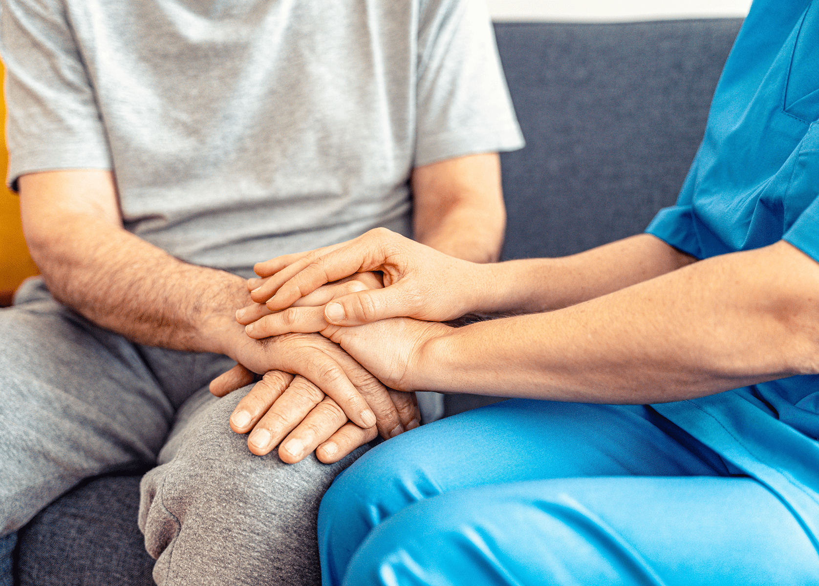 Caregiver providing emotional support through touch